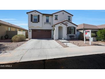Charming two-story home with a desert-landscaped front yard and a spacious two-car garage at 3446 N Mayfair St, Mesa, AZ 85213
