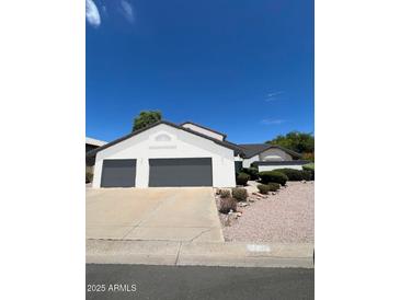 Two-story home with a three-car garage and desert landscaping at 5742 W Shannon St, Chandler, AZ 85226