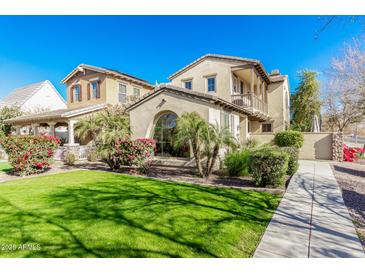 Two-story house with front yard, walkway, and landscaping at 13102 N 153Rd Ave, Surprise, AZ 85379