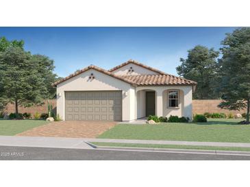 Single-story home with tile roof, two-car garage, and landscaped lawn at 15555 W Williams St, Goodyear, AZ 85338