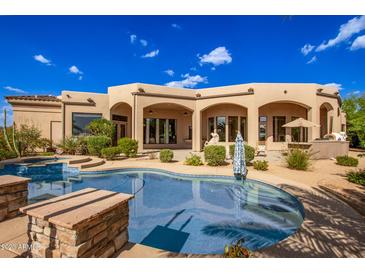 Luxury home with inviting pool, spa, and expansive patio perfect for outdoor entertaining at 26807 N 56Th St, Scottsdale, AZ 85266