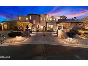 Elegant two-story home with stone accents and gated entry at 28626 N 108Th N Way, Scottsdale, AZ 85262