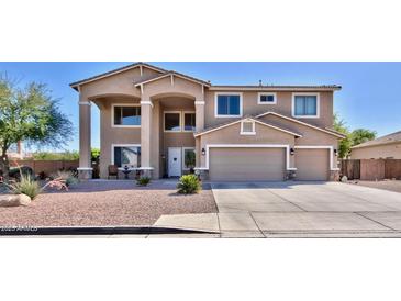 Two-story house with a large driveway and landscaped front yard at 11232 N 152Nd Ln, Surprise, AZ 85379