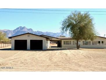 Ranch style home with two-car garage and mountain views at 1675 N Monterey Dr, Apache Junction, AZ 85120