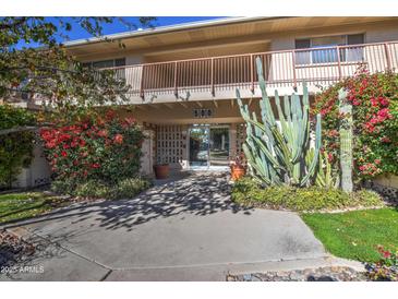 Building exterior showcasing mid-century architecture with landscaping at 500 W Clarendon Ave # F5, Phoenix, AZ 85013