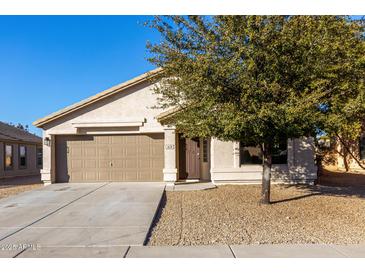 Charming house exterior featuring a two-car garage and landscaped yard at 1628 W San Tan Hills Dr, San Tan Valley, AZ 85144