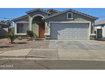 One-story house with attached garage and desert landscaping at 5802 S 14Th St, Phoenix, AZ 85040