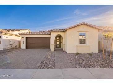 New construction home with attractive curb appeal and a two-car garage at 21259 E Sparrow Dr, Queen Creek, AZ 85142