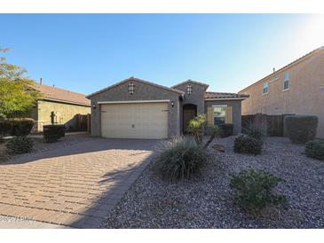 Single-story home with a two-car garage and landscaped front yard at 2759 E Mews Rd, Gilbert, AZ 85298