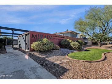 Exterior of Mirada Luxury Condominiums building, showing landscaping and walkway at 1241 E Medlock Dr # 110, Phoenix, AZ 85014