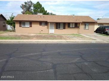 Ranch-style home with a spacious yard at 1340 E Crescent Ave, Mesa, AZ 85204