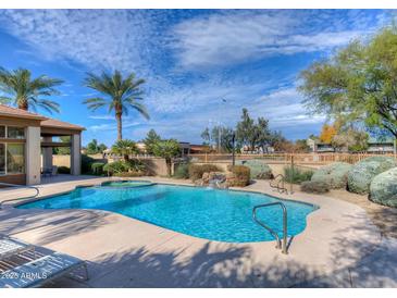 Inviting community pool with spa and waterfall feature at 1445 E Broadway Rd # 222, Tempe, AZ 85282