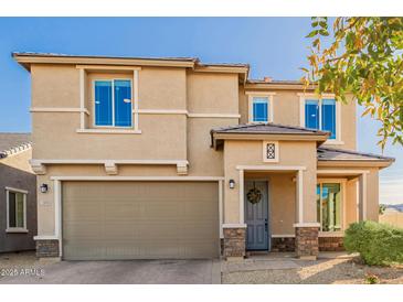 Two-story house with a two-car garage and landscaping at 2413 E Alta Vista Rd, Phoenix, AZ 85042