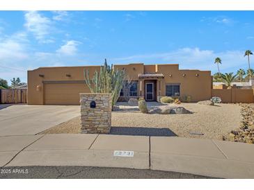 Single-story home with desert landscaping and a two-car garage at 2731 E Laurel Ln, Phoenix, AZ 85028