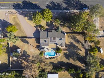 Aerial view showing home, pool, and expansive backyard at 4027 E Pueblo Ave, Mesa, AZ 85206