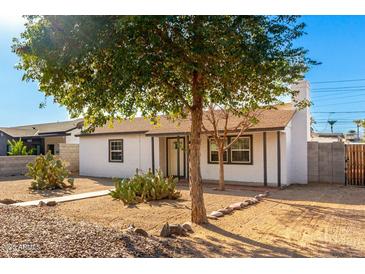 White house with landscaped yard and cacti at 4608 N 12Th Pl, Phoenix, AZ 85014