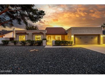 Charming single-story home with a two-car garage and landscaped front yard at 6131 E Kings Ave, Scottsdale, AZ 85254