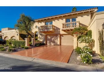 Spanish-style home with two-car garage and landscaped front yard at 7500 E Mccormick Pkwy # 78, Scottsdale, AZ 85258