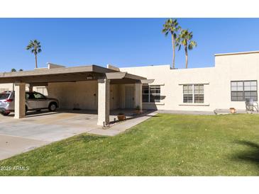 Cute condo with carport and grassy yard at 7756 E Coralbell Ave, Mesa, AZ 85208