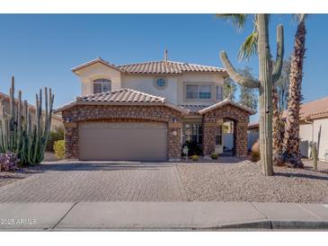 Two-story house with stone accents and a landscaped front yard at 1397 E Cheyenne St, Gilbert, AZ 85296