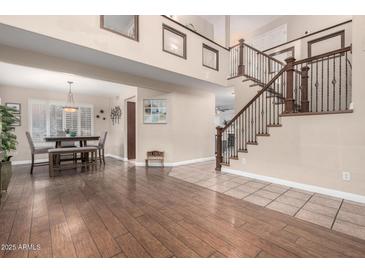 Spacious living area with hardwood floors and staircase at 1540 W Orchid Ln, Chandler, AZ 85224