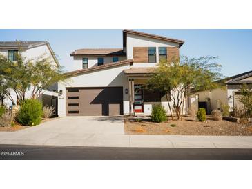 Modern two-story house with attached garage and landscaped front yard at 15541 S 181St Ln, Goodyear, AZ 85338