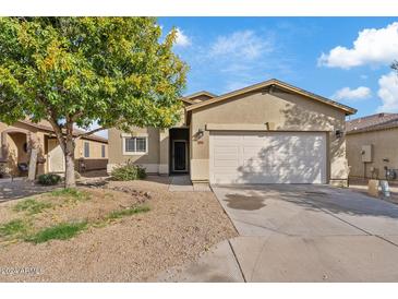 Single-story house with a two-car garage and a landscaped front yard at 1866 E Dust Devil Dr, San Tan Valley, AZ 85143