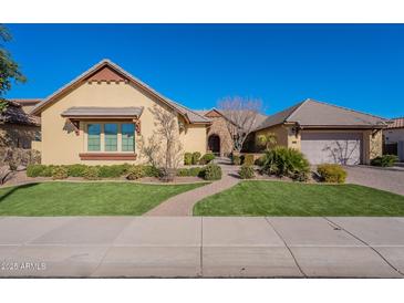 Beautiful single-story home with a landscaped yard and two-car garage at 2952 E Warbler Rd, Gilbert, AZ 85297