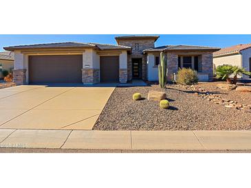 Single-story home with stone accents and desert landscaping at 3020 N 165Th Ave, Goodyear, AZ 85395