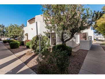 Residential building showcasing stucco exterior and landscaping at 4730 W Northern Ave # 1127, Glendale, AZ 85301