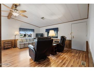 Spacious living room with wood floors and comfy seating at 8103 E Southern Ave # 39, Mesa, AZ 85209