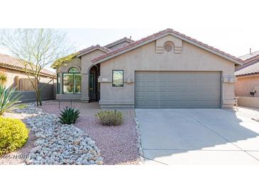 Single-story home with a two-car garage and desert landscaping at 10359 E Morning Star Dr, Scottsdale, AZ 85255