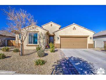 One-story home with desert landscaping and two-car garage at 18216 W Foothill Dr, Surprise, AZ 85387