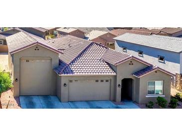 New home exterior with two-car garage and attractive landscaping at 19583 W Cheery Lynn Rd, Buckeye, AZ 85396