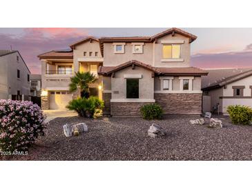 Two-story house with stone accents and landscaping at 2626 E Bear Creek Ln, Phoenix, AZ 85024