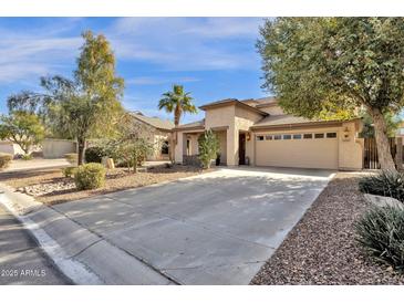 Attractive single-story home with a two-car garage and well-manicured landscaping at 43579 W Arizona Ave, Maricopa, AZ 85138