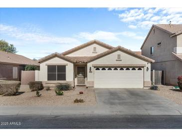 Single-story house with a two-car garage and desert landscaping at 45762 W Dirk St, Maricopa, AZ 85139