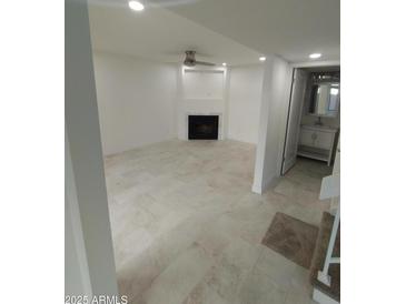 Bright living room with fireplace and tile floors at 2834 S Extension Rd # 1032, Mesa, AZ 85210