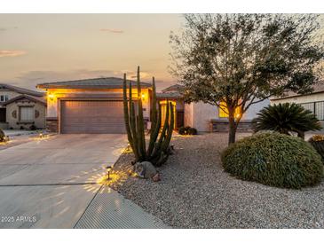 Attractive single-story home with landscaped desert front yard and two-car garage at 30792 N Orange Blossom Cir, San Tan Valley, AZ 85143