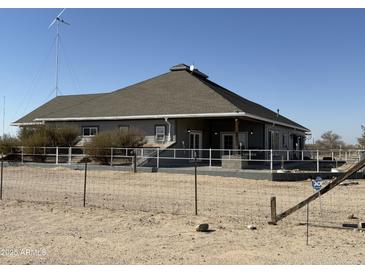 Ranch style home with covered patio and fenced yard at 3656 S Turner Rd, Buckeye, AZ 85326