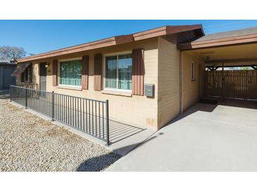 House exterior showcasing a carport and well-maintained yard at 3750 W Marshall Ave, Phoenix, AZ 85019