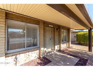 Brick house with carport and landscaped yard at 9676 W Mountain View Rd # B, Peoria, AZ 85345