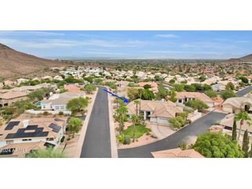 Aerial view of house and neighborhood, showcasing desirable location and landscape at 1604 E Sheena Dr, Phoenix, AZ 85022