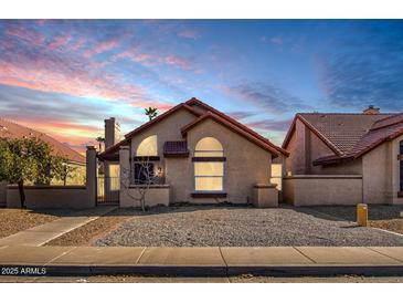 Cute single-story home with a landscaped front yard and walkway at 1841 E Secretariat Dr, Tempe, AZ 85284