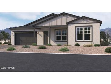 Single-story home with modern facade, two-car garage, and landscaped front yard at 22910 E Alyssa Rd, Queen Creek, AZ 85142