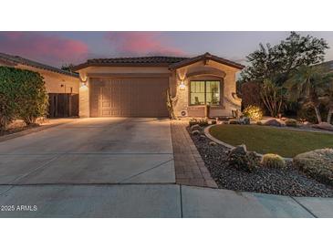 Well-maintained single-story home with a two-car garage and landscaped front yard at 337 W Stanley Ave, San Tan Valley, AZ 85140