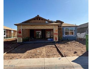 New construction home exterior, showing framing and landscaping underway at 5545 E Rock Bush Ln, San Tan Valley, AZ 85140