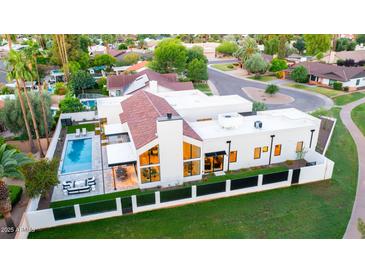 Modern home with pool, patio and large fenced yard in a verdant community at 8255 E Morgan Trl, Scottsdale, AZ 85258