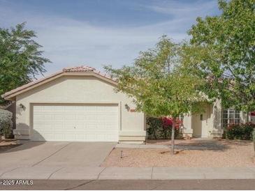 One-story home with a large driveway and mature landscaping at 4534 E Muriel Dr, Phoenix, AZ 85032