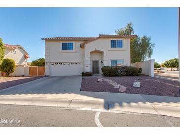 Two-story house with a two-car garage and landscaped front yard at 5731 W Aster Dr, Glendale, AZ 85304